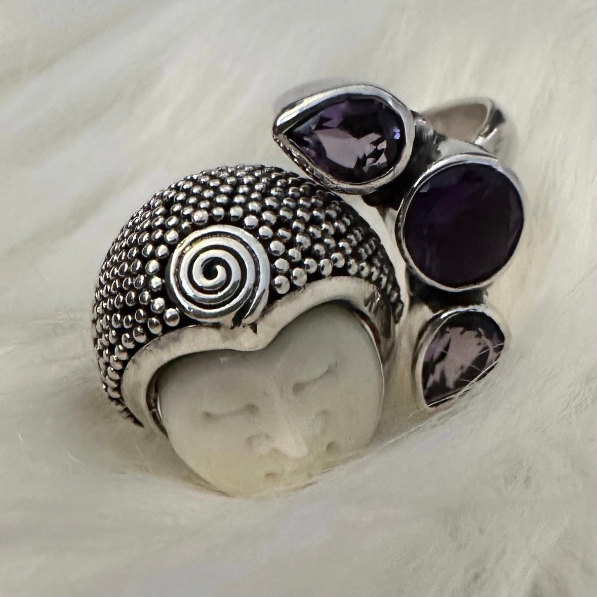 Unique exotic hand-crafted artisanal solid 925 sterling silver Balinese carved bone face ring with faceted/cut Amethyst gemstones