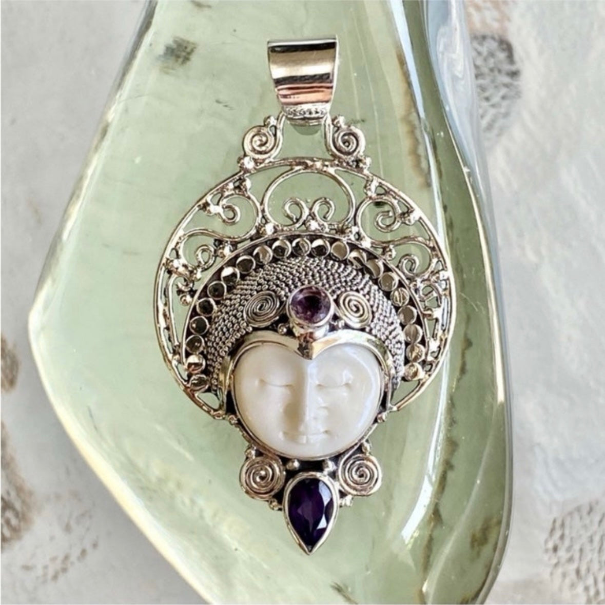 Stunning unique exotic hand-crafted artisanal solid 925 sterling silver Balinese carved bone face necklace pendant with faceted/cut Amethyst gemstones