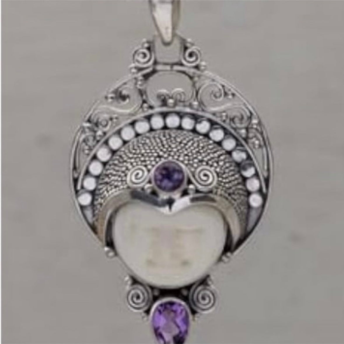 Stunning unique exotic hand-crafted artisanal solid 925 sterling silver Balinese carved bone face necklace pendant with faceted/cut Amethyst gemstones