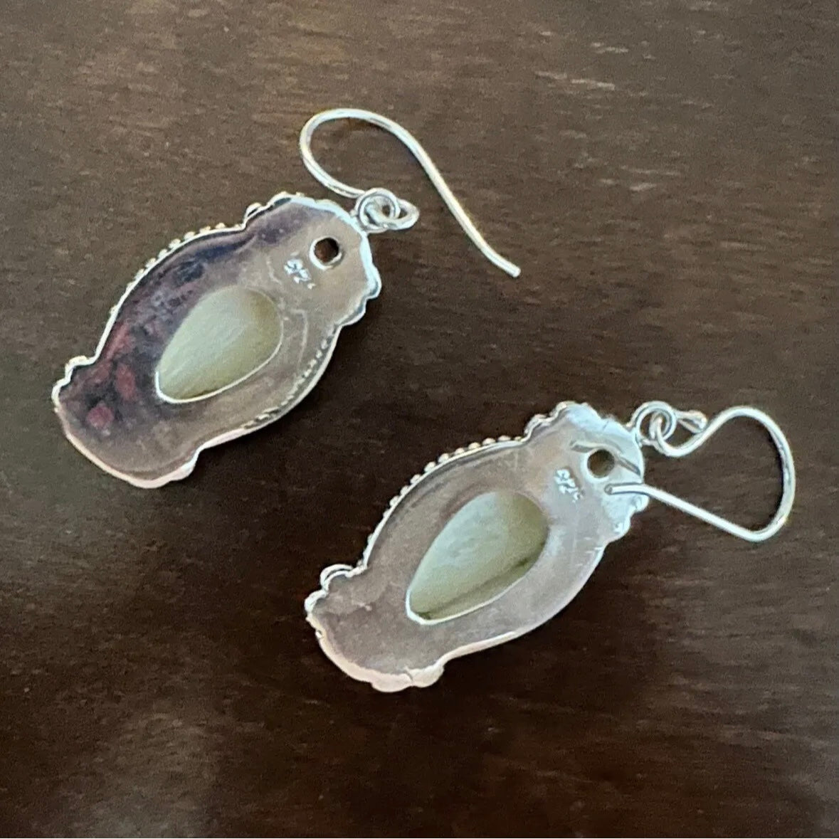 Unique exotic hand-crafted artisanal solid 925 sterling silver Balinese carved bone face earrings with faceted/cut Garnet gemstones