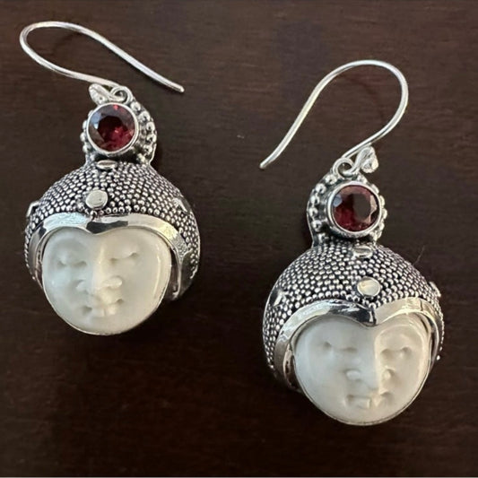 Hand-crafted 925 sterling silver Balinese carved bone face earrings with faceted/cut Garnet gemstones